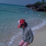 A girl playing on a beach